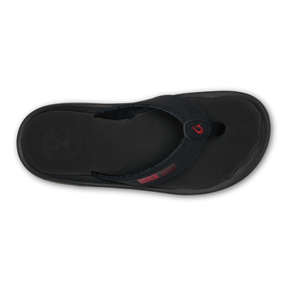 Black thong sandal with red logo accent and contoured footbed, shown from above.