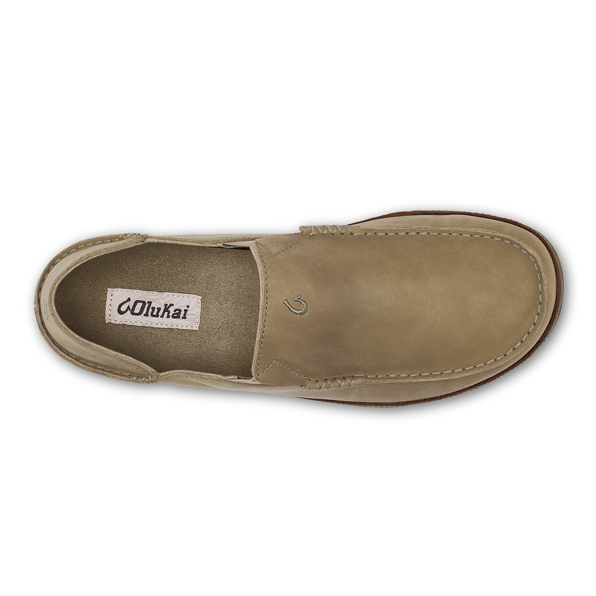 Tan leather slip-on shoe with stitched seams and OluKai brand label visible on insole.