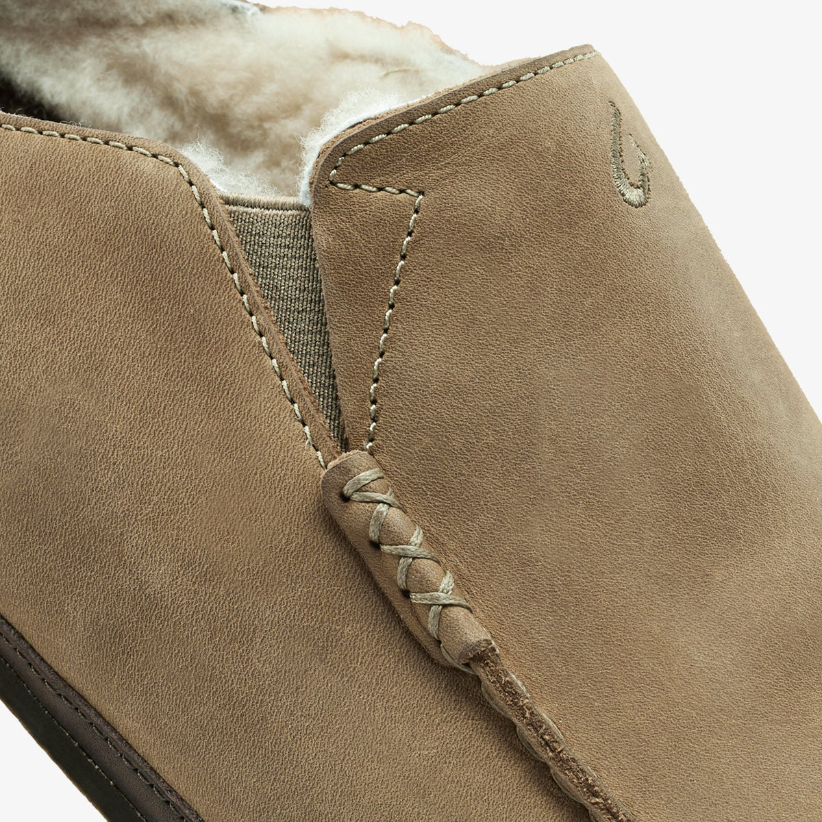 Clay leather slipper with fleece lining, dark java sole, and wrapped tie detail at collar.