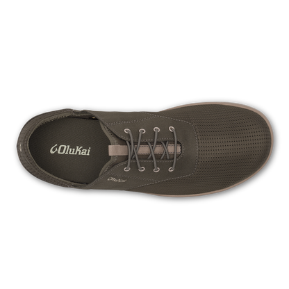 Gray canvas lace-up shoe with perforated upper and OluKai branding, shown from above.