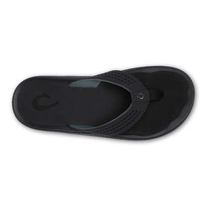 Black thong sandal with perforated strap and cushioned footbed, shown from above.