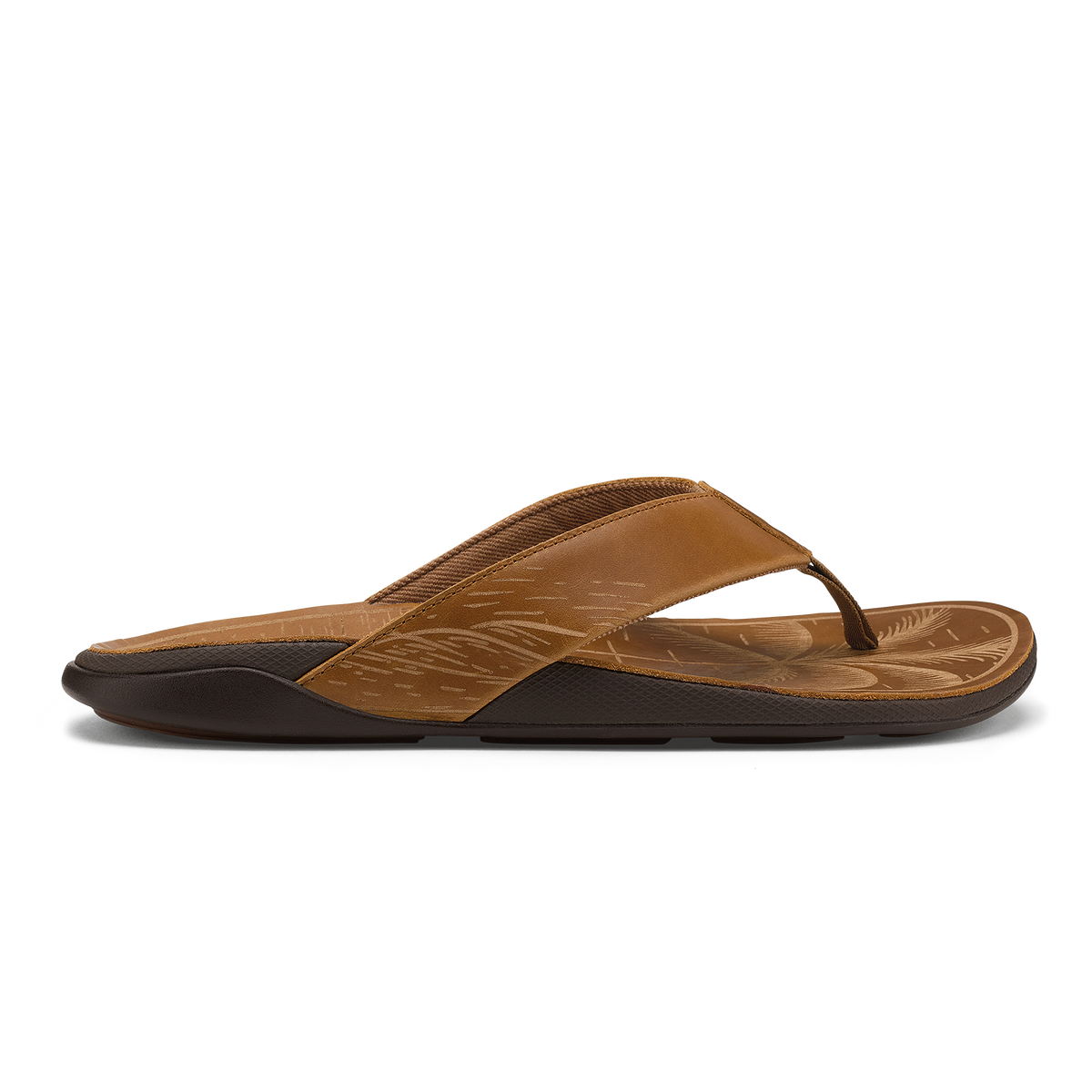 Tan leather flip-flop with black sole and embossed leaf pattern on footbed.
