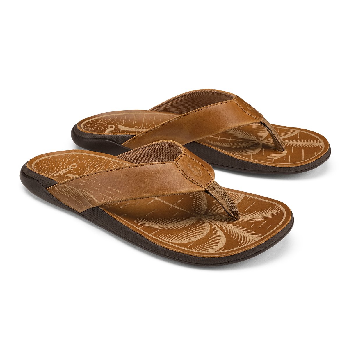Pair of tan leather flip-flops with black soles and decorative carved footbeds featuring fox designs.