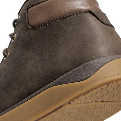 Dark brown suede hiking boot with tan rubber sole and lace-up closure, shown from heel angle.
