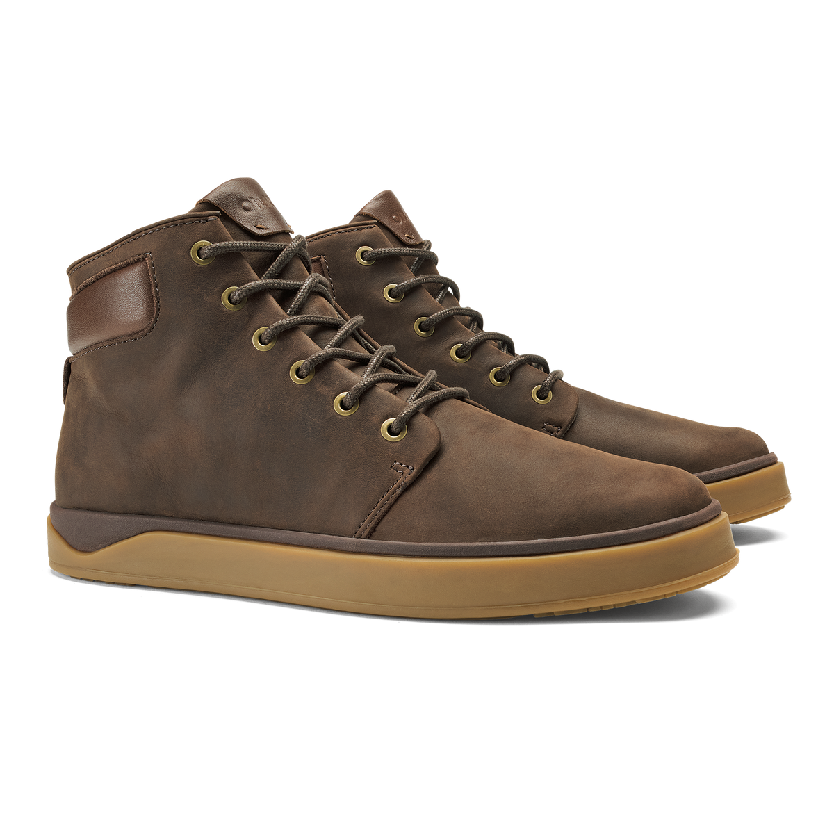 Pair of dark brown lace-up boots with toffee-colored rubber sole and padded ankle collar.
