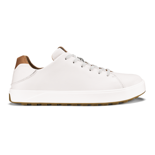 White leather low-top sneaker with tan heel tab and white laces on white sole.