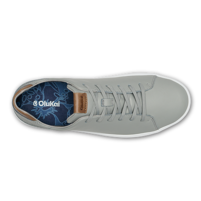 Grey leather high-top sneaker with tan heel patch and white sole, shown from above with navy patterned insole visible.