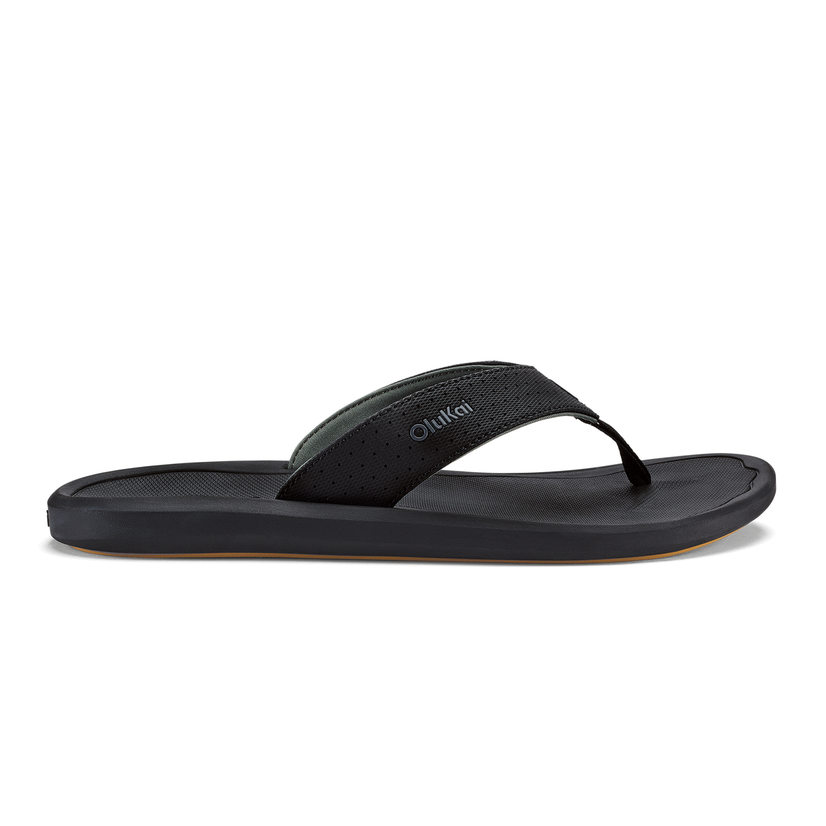 Black lava rock flip-flop sandal with textured strap and flat sole against white background.