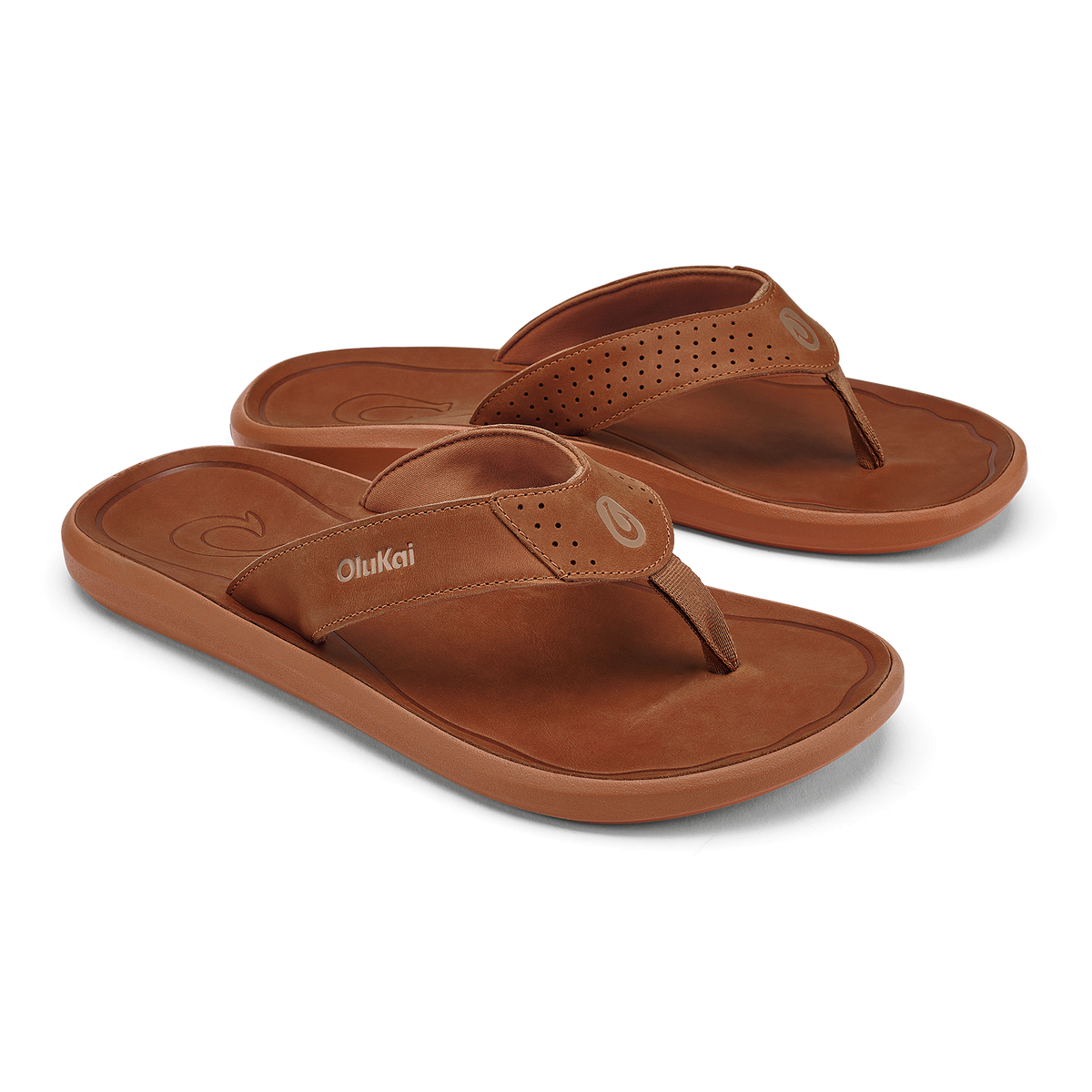 Pair of brown leather flip-flops with perforated straps and cushioned soles.