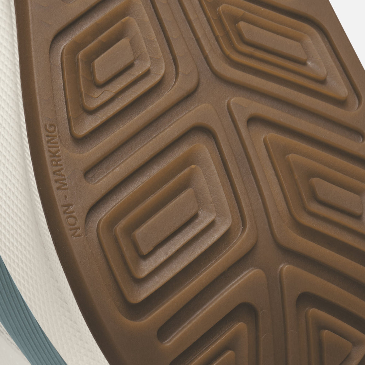 Brown sole with geometric tread pattern and "NON-MARKING" text visible.