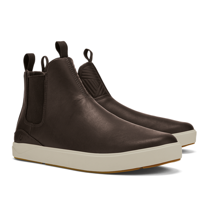 Dark brown leather Chelsea boot with cream-colored sole and elastic side panels.