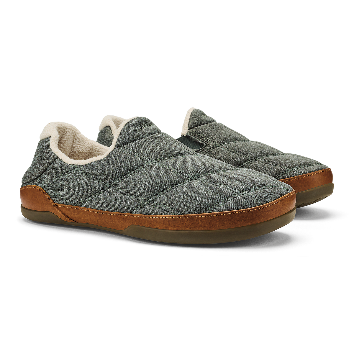 Pair of gray quilted slip-on slippers with tan fleece lining and brown leather heel and sole.