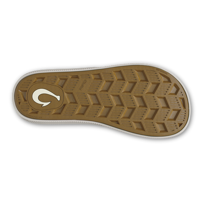 Tan rubber sole with chevron tread pattern and white curved logo detail.