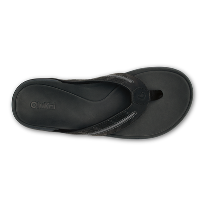 Black thong sandal with textured strap and molded footbed, shown from above.