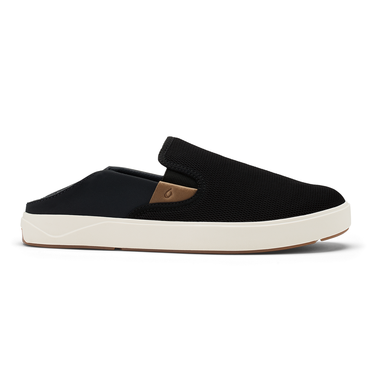 Black and tan slip-on shoe with textured upper, cream sole, and tan heel accent.