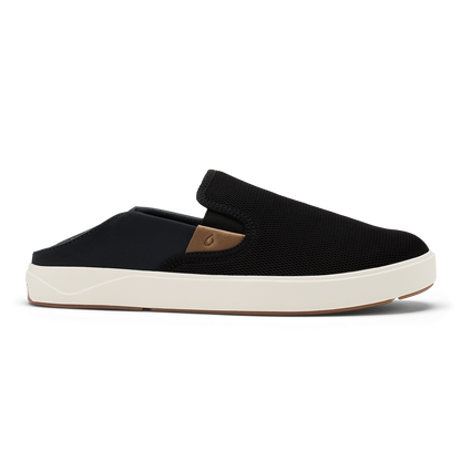 Black and tan slip-on shoe with textured upper, cream sole, and tan heel accent.