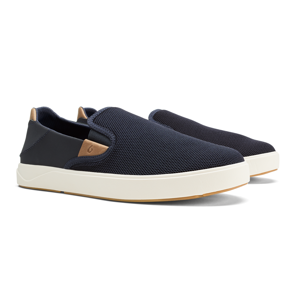 Navy slip-on sneaker with tan heel tab and cream platform sole.