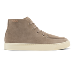 Taupe grey suede chukka boot with tan laces and cream-colored sole, shown in side profile.