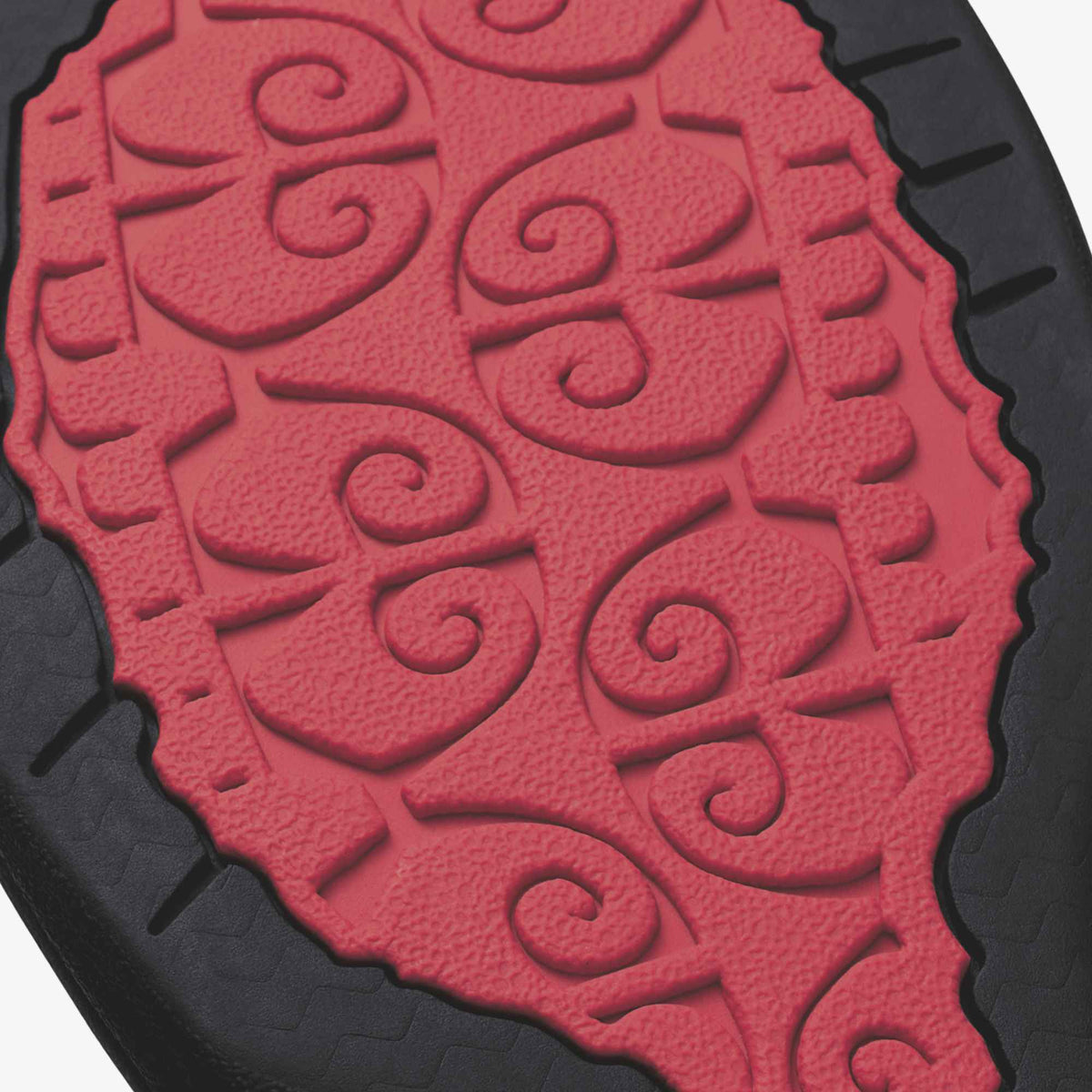 Hot pink and black mat with embossed spiral pattern and scalloped edges.