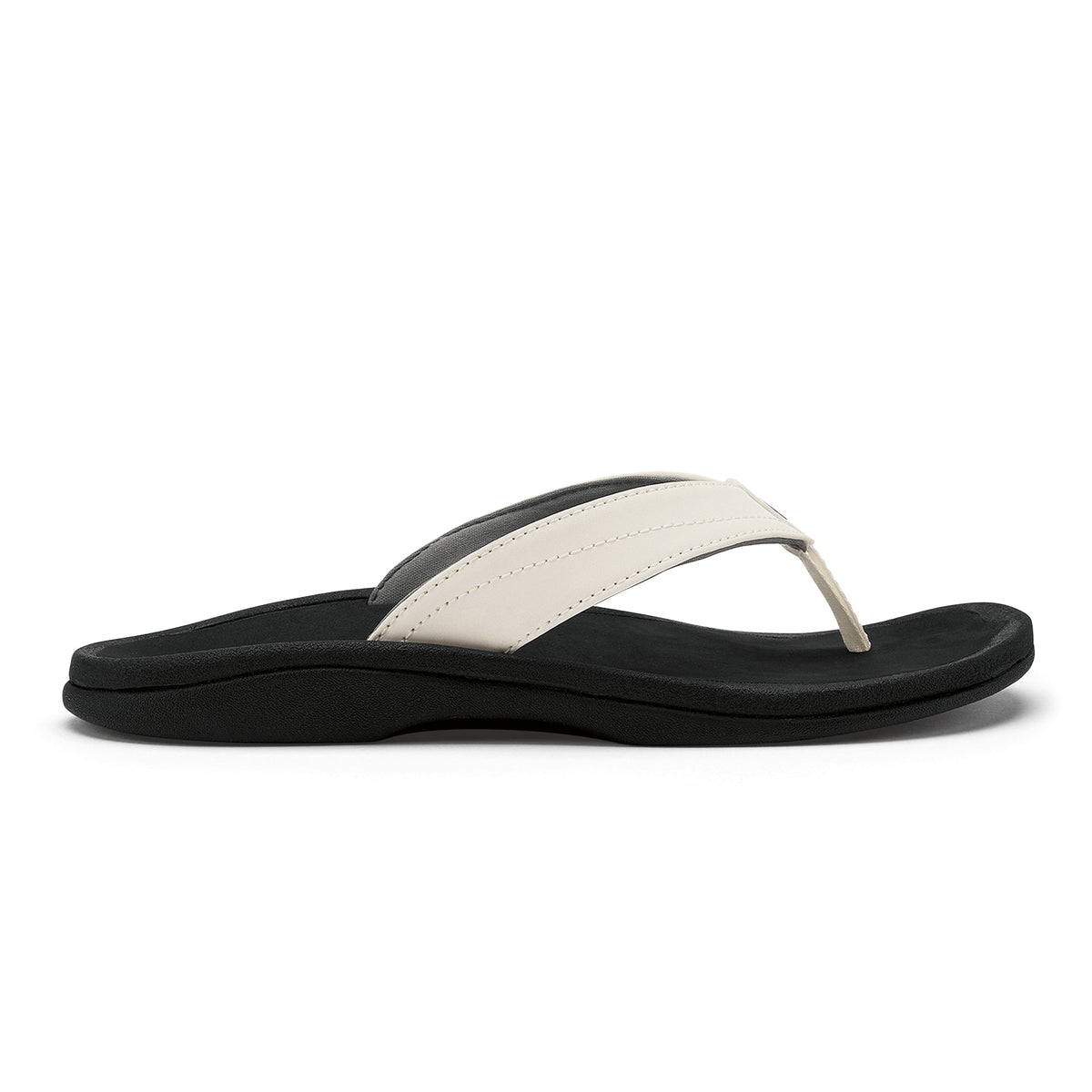 White and black thong sandal with black foam sole and cushioned footbed.