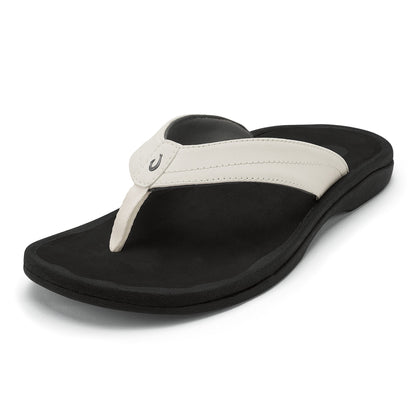 Black and white thong flip-flop sandal with cushioned sole and padded white toe post strap.
