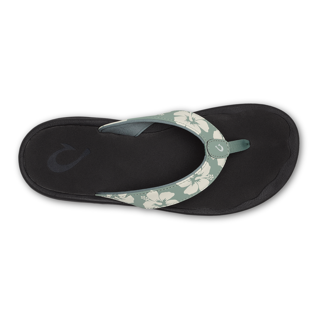 Black flip-flop sandal with sage green floral-patterned strap and circular buckle detail, viewed from above.