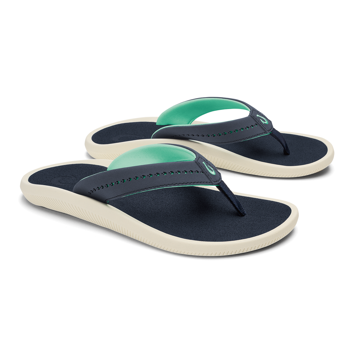 Pair of navy and mint green flip-flops with cream-colored soles and beaded thong straps.