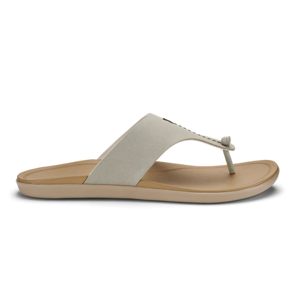 Cream and tan thong sandal with padded fabric upper and cushioned sole.