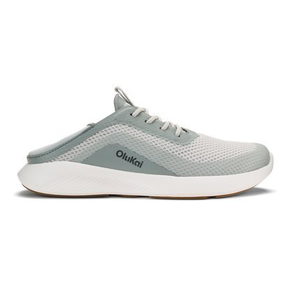 Gray and white Olukai slip-on athletic shoe with mesh upper and white cushioned sole.
