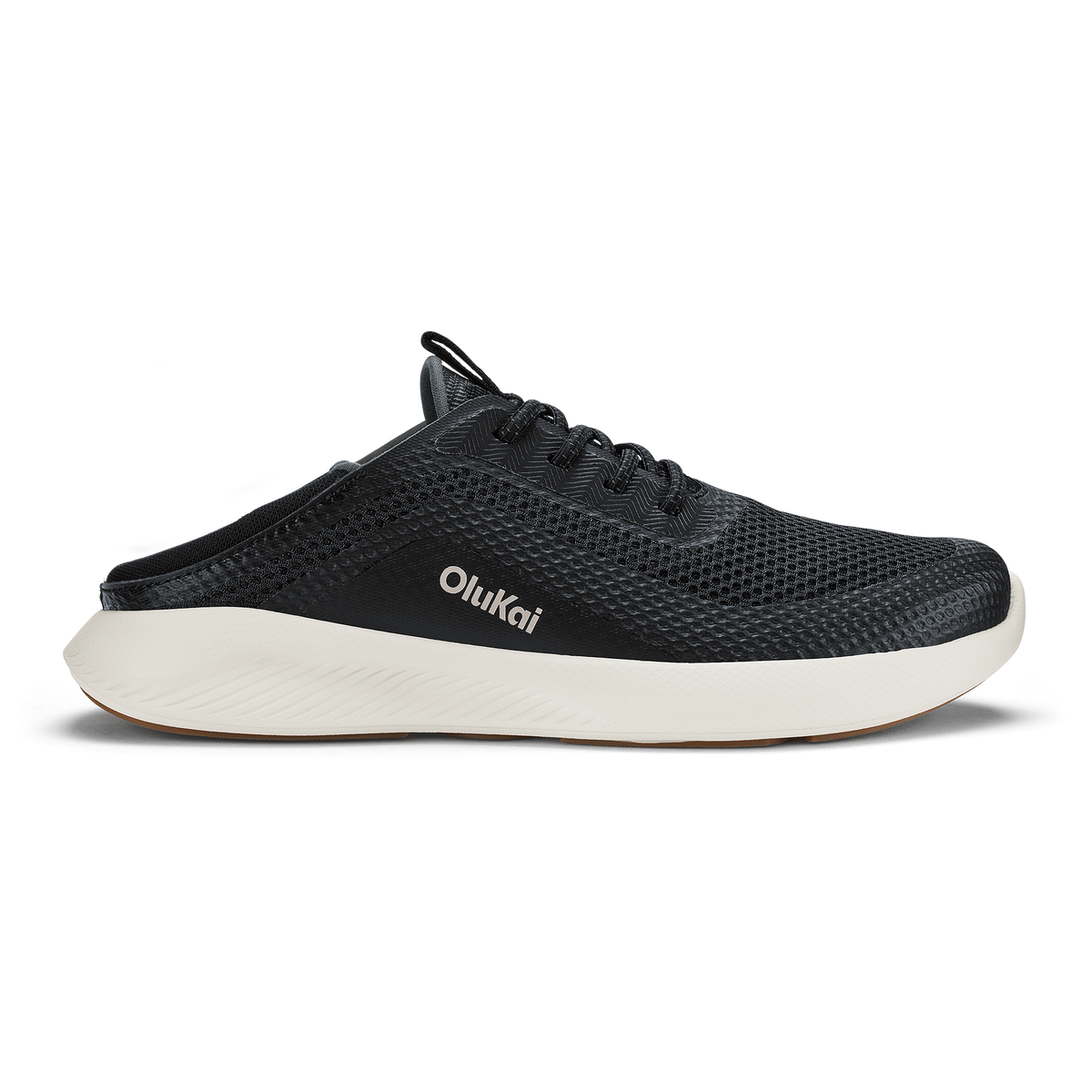 Black mesh slip-on shoe with white midsole sole and OluKai branding on the side.