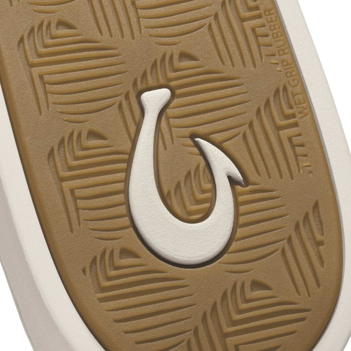 Tan rubber sole with white hook symbol and geometric line pattern detail.