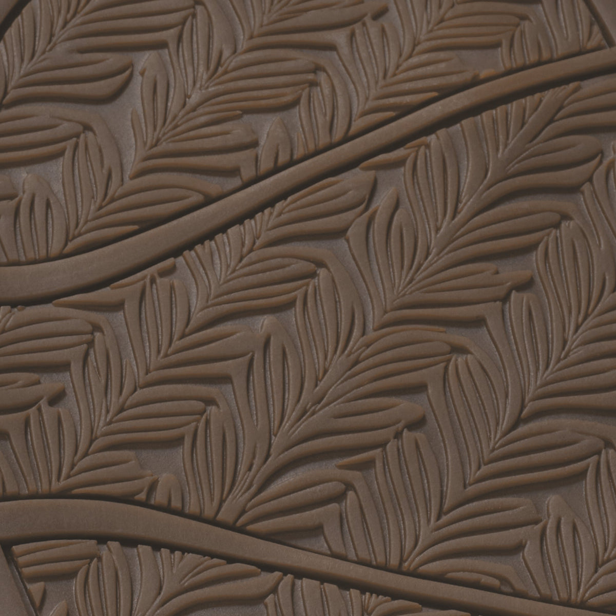 Warm sand-colored sole with embossed leaf pattern and curved ridges.