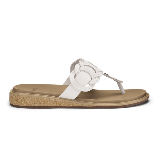 White leather thong sandal with braided detail and tan cork-textured sole.