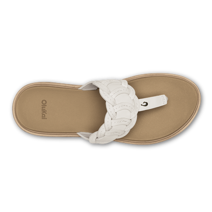Thong sandal with white braided straps and warm sand-colored footbed, viewed from above.