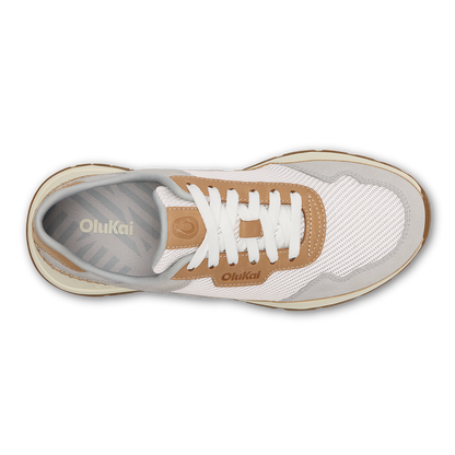 OluKai Koke sneaker in bright white and tan with white laces, shown from above.