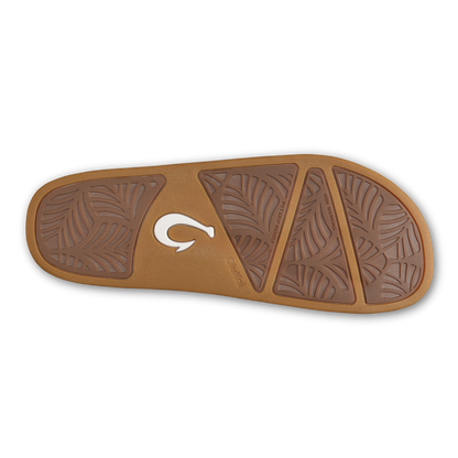 Tan slide sandal sole with leaf-pattern grip sections and white logo detail.