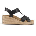 Black leather T-strap sandal with woven jute wedge heel and warm sand-colored suede footbed.