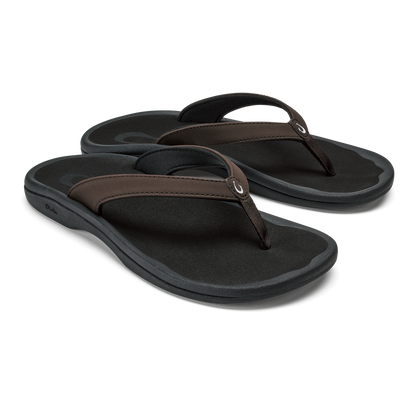 Pair of black flip-flops with dark brown straps and cushioned soles.