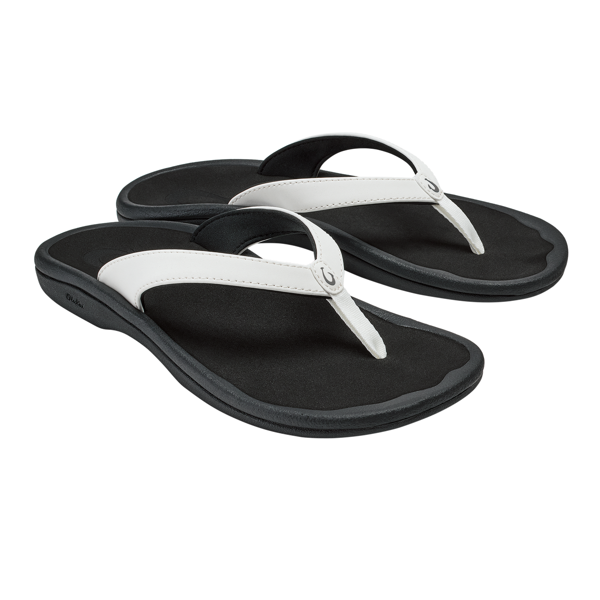 Pair of black flip-flops with white straps and curved black footbeds.