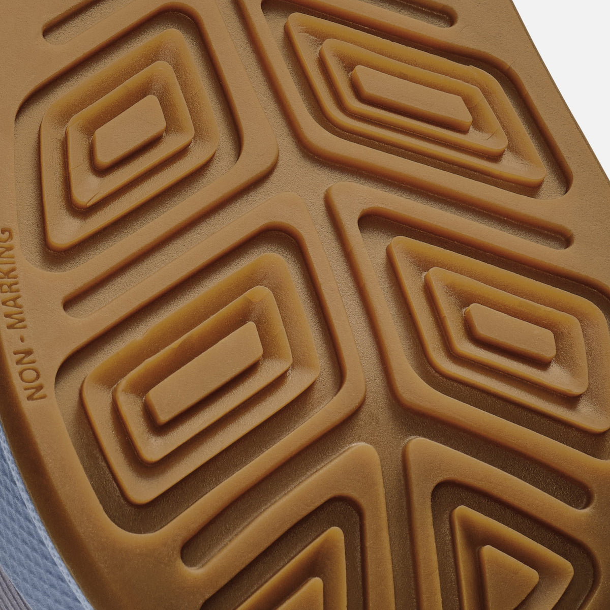 Tan sole with geometric nested rectangle pattern and "non-marking" text embossed on edge.