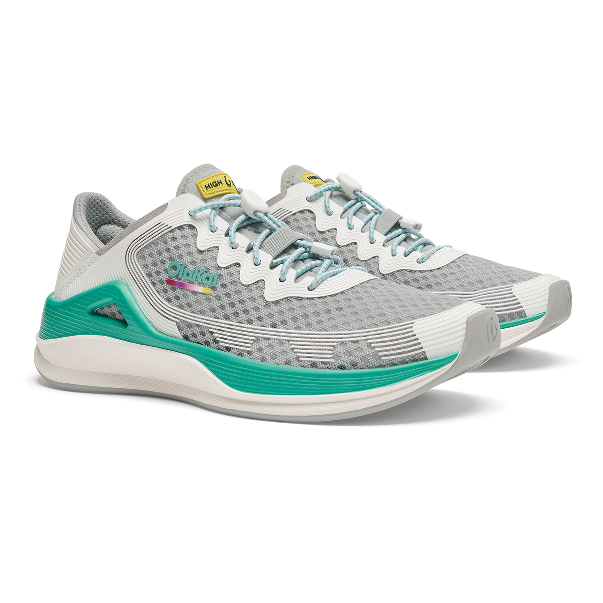 Grey and white running shoe with bright white laces, teal heel accents, and textured mesh upper displayed from the side angle