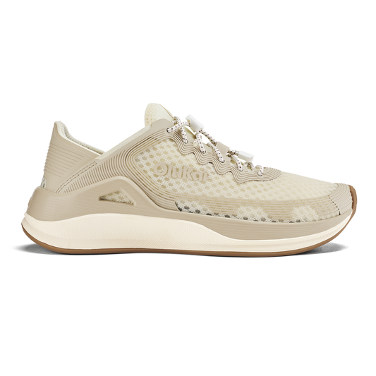 Cream-colored running shoe with mesh and ribbed textile upper, white midsole, and tan rubber outsole.