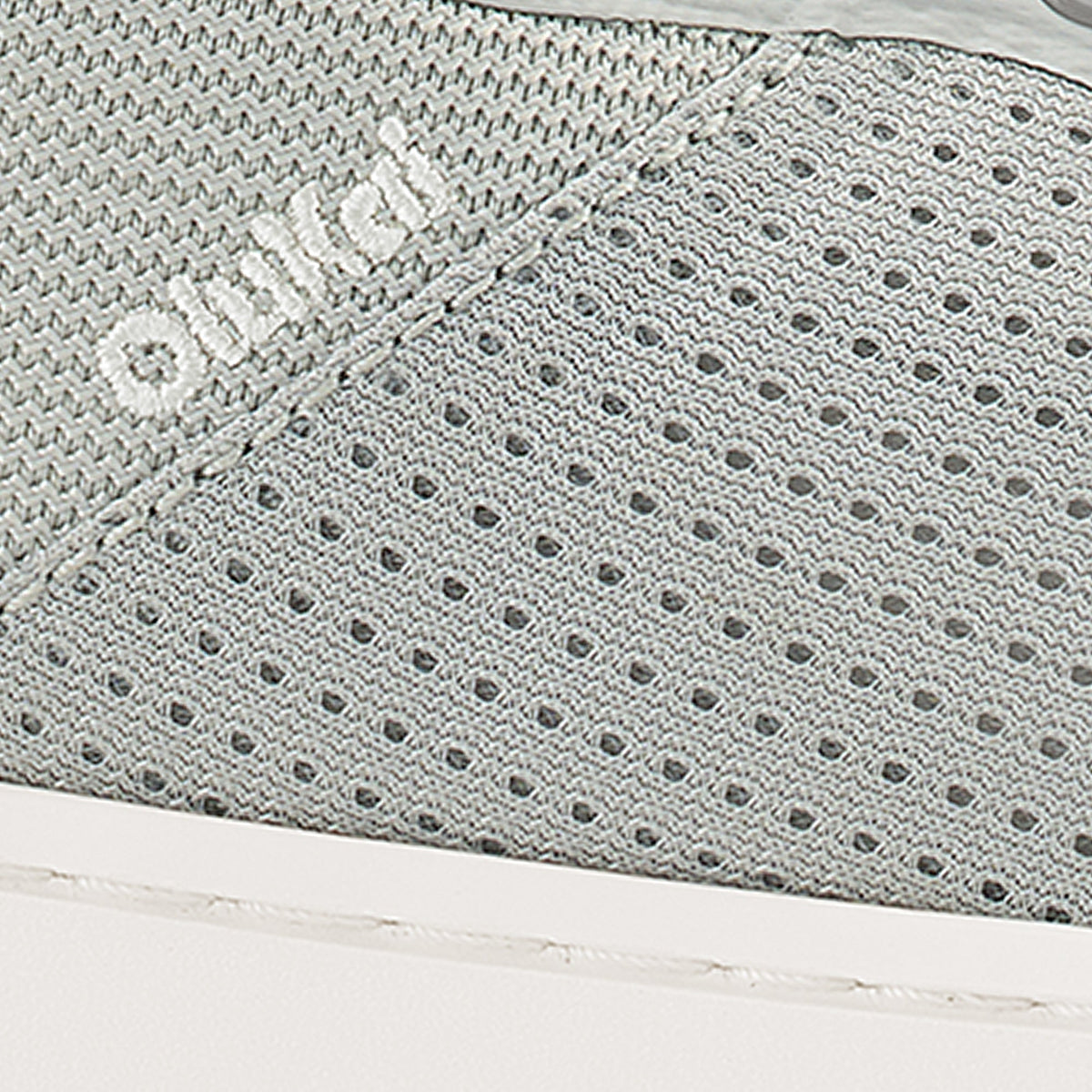 Cloud grey textured fabric with geometric patterns and perforated details.