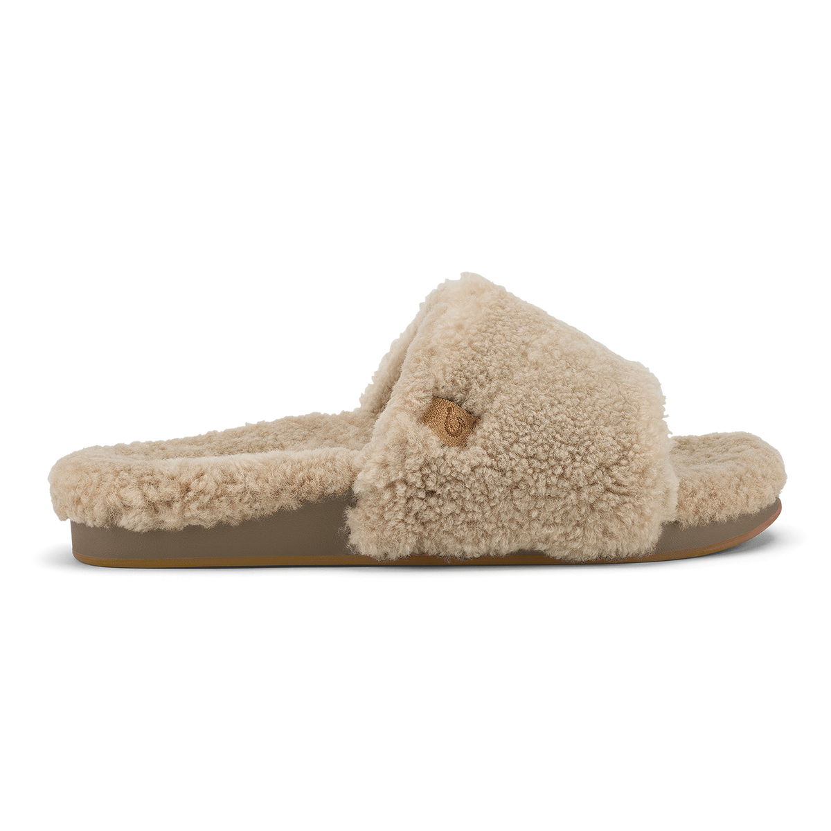 Tan fleece slide slipper with textured upper and tan sole, shown in profile view.