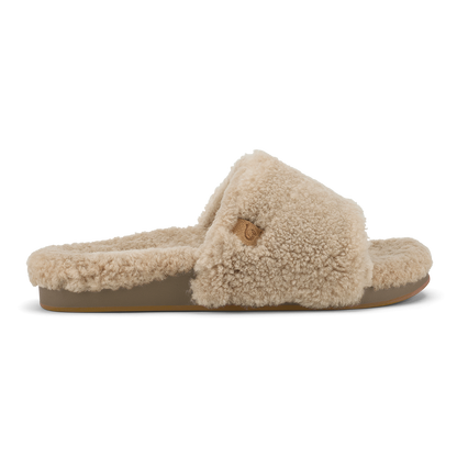 Tan fleece slide slipper with textured upper and tan sole, shown in profile view.